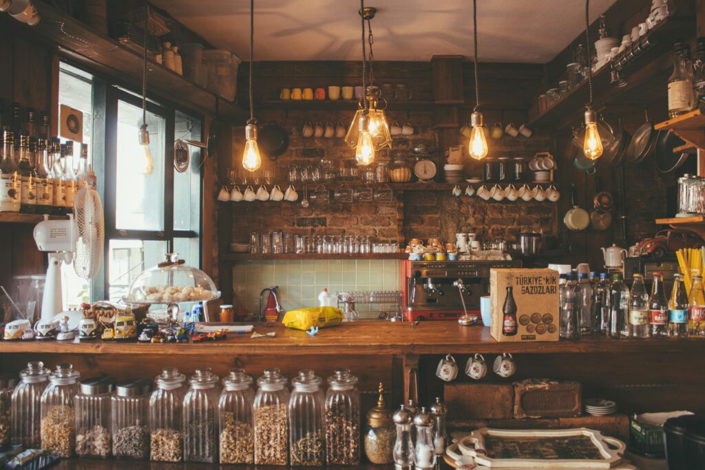 pexels photo 2079438 2079438 A cozy cafe with rustic decor, pendant lights, and glass jars creates a vintage ambiance.